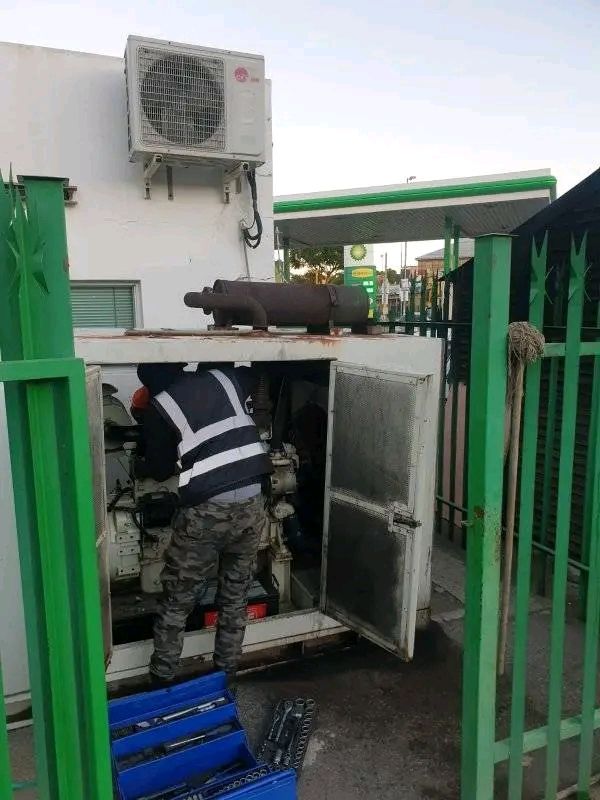 Technician servicing a generator